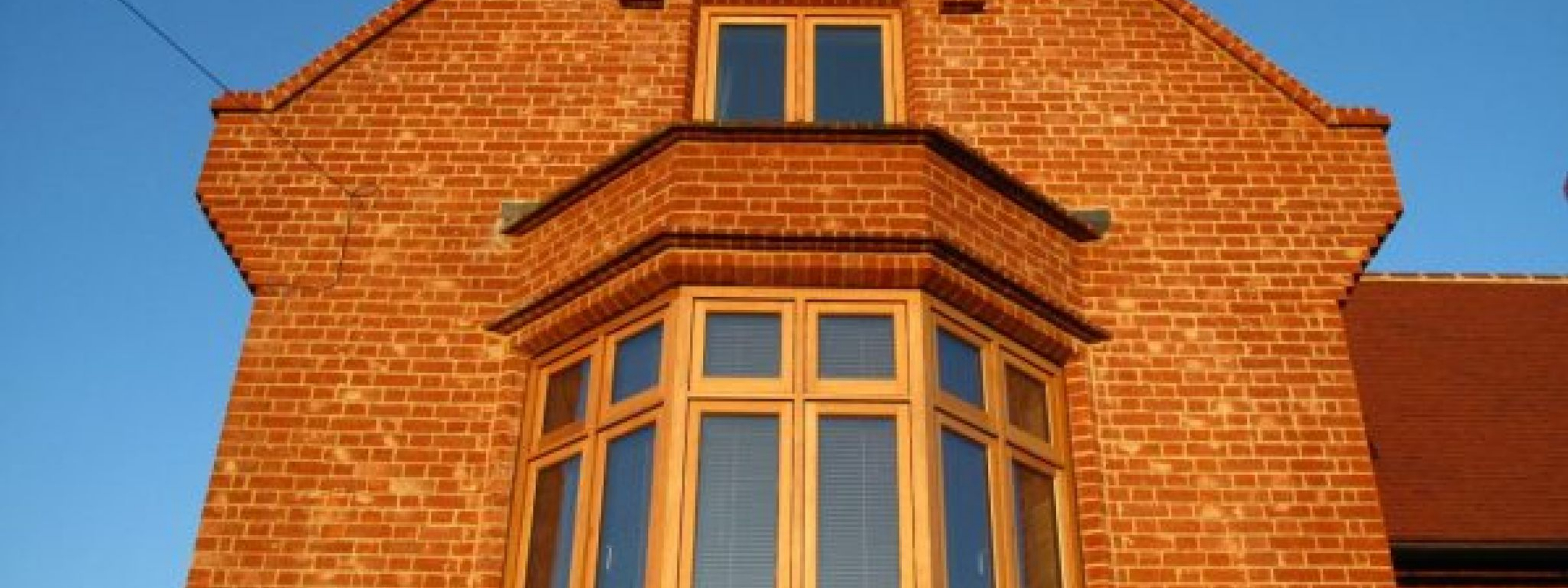 Brick house frontage featuring plinth bricks